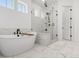 Spa-like bathroom featuring a soaking tub and separate shower at 11383 Autumn Moon St, Littleton, CO 80125