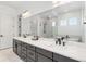 Elegant bathroom with dual vanities, granite countertops, and a glass enclosed shower at 11383 Autumn Moon St, Littleton, CO 80125