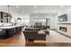 Open floor plan showcases kitchen and living room with fireplace at 11383 Autumn Moon St, Littleton, CO 80125