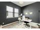 Office has modern colors, a large desk, and good natural light at 11383 Autumn Moon St, Littleton, CO 80125
