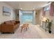 Finished basement featuring a comfortable couch, stylish decor, and an open doorway to the bedroom at 421 Elati St, Denver, CO 80204