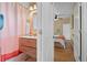 Stylish bathroom with modern vanity, patterned shower curtain, and view into a bedroom at 421 Elati St, Denver, CO 80204