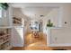 Open dining room area with hardwood floors, open layout, and view into the kitchen at 421 Elati St, Denver, CO 80204