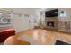 Bright living room with a stone fireplace, hardwood floors, and natural light at 421 Elati St, Denver, CO 80204
