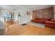 Comfortable living room with an exposed brick wall and modern seating at 421 Elati St, Denver, CO 80204