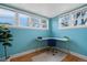 Bright office with large windows, blue walls, and modern desk at 421 Elati St, Denver, CO 80204