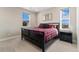 Comfortable bedroom with plush carpeting, large windows, and a serene atmosphere at 3128 Bivouac Pt, Castle Rock, CO 80108