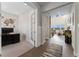 Bright entryway featuring soaring ceilings, hardwood floors, and an adjacent office space at 3128 Bivouac Pt, Castle Rock, CO 80108