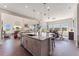 Open-concept kitchen featuring granite countertops, pendant lighting, and stainless steel appliances at 3128 Bivouac Pt, Castle Rock, CO 80108