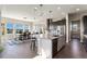 Bright kitchen with stainless steel appliances, granite countertops, and ample dining space at 3128 Bivouac Pt, Castle Rock, CO 80108