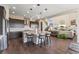 Well-appointed kitchen featuring a large island, modern appliances, and seamless flow to the living area at 3128 Bivouac Pt, Castle Rock, CO 80108
