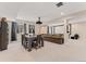 The cozy living room has a large couch, media projector, and a dining table with seating for six at 3128 Bivouac Pt, Castle Rock, CO 80108