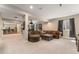 The cozy living room has a large couch, media projector, and opens to a bar with seating at 3128 Bivouac Pt, Castle Rock, CO 80108