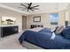 Bedroom featuring a large bed with blue bedding, a dresser and carpeted floors at 3128 Bivouac Pt, Castle Rock, CO 80108