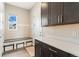 Functional mud room with built-in storage, coat hooks, and convenient access to the outdoors at 3128 Bivouac Pt, Castle Rock, CO 80108