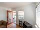 Cozy entryway featuring hardwood floors, a window, and a view of the covered front porch at 4849 Lincoln St, Denver, CO 80216