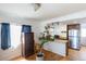 Eat-in kitchen with updated stainless steel refrigerator and a breakfast bar at 4849 Lincoln St, Denver, CO 80216