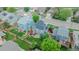 Beautiful home from an aerial view, featuring mature trees and a well-manicured yard at 9884 Sydney Ln, Highlands Ranch, CO 80130