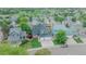 Overhead view featuring a well-manicured front lawn and mature trees at 9884 Sydney Ln, Highlands Ranch, CO 80130