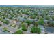 Aerial view showcasing a neighborhood with lush trees, parks and well maintained homes at 9884 Sydney Ln, Highlands Ranch, CO 80130