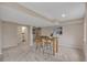 Spacious basement featuring a cozy seating area and table with four stools, perfect for entertaining at 9884 Sydney Ln, Highlands Ranch, CO 80130