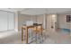 Finished basement area featuring a table with seating and ample storage with double doors at 9884 Sydney Ln, Highlands Ranch, CO 80130