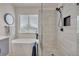 Bright bathroom featuring a modern tub, glass shower, and stylish fixtures providing a spa-like experience at 9884 Sydney Ln, Highlands Ranch, CO 80130
