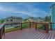 Outdoor deck with brown composite, railing, and view of the neighborhood at 9884 Sydney Ln, Highlands Ranch, CO 80130