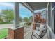Inviting porch with seating, offers a view of the street and neighborhood at 9884 Sydney Ln, Highlands Ranch, CO 80130