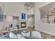 Spacious living room featuring high ceilings, fireplace, and modern furnishings at 9884 Sydney Ln, Highlands Ranch, CO 80130