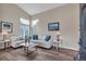 Bright living room with vaulted ceilings, lots of windows, and comfortable seating at 9884 Sydney Ln, Highlands Ranch, CO 80130