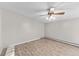 Simple bedroom with hardwood floors and ceiling fan at 595 S Alton Way # 5D, Denver, CO 80247