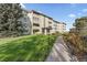 Attractive building exterior with landscaping and walkway at 595 S Alton Way # 5D, Denver, CO 80247