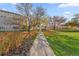 Landscaped grounds with a paved pathway, mature trees, and lush green lawn at 595 S Alton Way # 5D, Denver, CO 80247