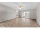 Bright living room with hardwood floors and sliding glass door at 595 S Alton Way # 5D, Denver, CO 80247