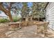 Entertain outdoors with this beautiful patio and stone fireplace in the backyard at 2120 Oak Pl, Thornton, CO 80229