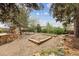 Spacious backyard featuring multiple garden beds and stone accents at 2120 Oak Pl, Thornton, CO 80229