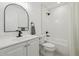 Bright bathroom with updated vanity, classic subway tile shower, and matte black fixtures at 2120 Oak Pl, Thornton, CO 80229