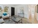 Bright and inviting living area with stylish decor, with seamless flow from front door and plenty of natural light at 2120 Oak Pl, Thornton, CO 80229