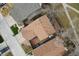 Aerial view showcasing the property's roof, well-maintained yards, patio areas, and nearby street at 8737 Garrison Ct, Arvada, CO 80005