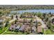 Aerial view of homes in the neighborhood, showcasing mature trees and a lake at 8737 Garrison Ct, Arvada, CO 80005