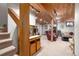 Partially finished basement featuring wood ceilings, staircase, and an open floor plan at 8737 Garrison Ct, Arvada, CO 80005