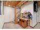Partially finished basement with wooden ceiling, staircase, and ample space for custom design at 8737 Garrison Ct, Arvada, CO 80005