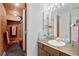 Unique bathroom featuring wood paneling and a combination shower and bath at 8737 Garrison Ct, Arvada, CO 80005