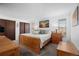 Spacious bedroom with natural wood furniture, a serene ambiance, and ample closet space at 8737 Garrison Ct, Arvada, CO 80005