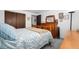 Comfortable bedroom features a neutral color scheme, wooden furnishings, and ample space for relaxation at 8737 Garrison Ct, Arvada, CO 80005