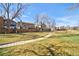 Property with walking paths and open grassy area at 8737 Garrison Ct, Arvada, CO 80005