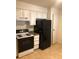 Kitchen featuring white cabinets, tiled floor and modern appliances in a clean design at 2355 E Geddes Ave # G24, Centennial, CO 80122
