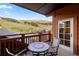 Inviting balcony features mountain views, table and chairs, perfect for enjoying the outdoors at 1521 Ski Hill Rd # 8313, Breckenridge, CO 80424