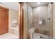Beautiful bathroom featuring a glass-enclosed shower and separate soaking tub for relaxation at 1521 Ski Hill Rd # 8313, Breckenridge, CO 80424